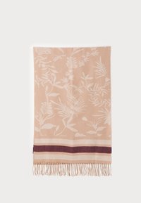 Floral-patterned blanket in soft peach with white botanical designs. Features dark maroon and cream striped accents, finished with fringing.