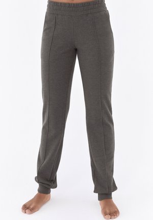 Graue Jogginghosen aus einem weichen, dehnbaren Material mit einem elastischen Bund, schmal zulaufenden Beinen und seitlichen Nähten als gestalterisches Detail.