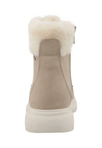 Beige Wildleder-Stiefelette mit Kunstfellkragen, runder Zehenpartie und weißer Gummisohle. Verfügt über einen seitlichen Reißverschluss für ein einfaches An- und Ausziehen.