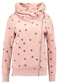 Felpa rosa con collo alto, chiusura con zip, maniche lunghe e pois neri. Realizzata in un tessuto morbido con orlo e polsi a coste.