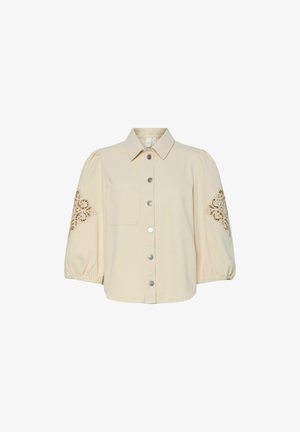Kremfarget skjorte med knapper og korte pufferm, med en enkelt lomme og intrikat gullbroderi på ermene.