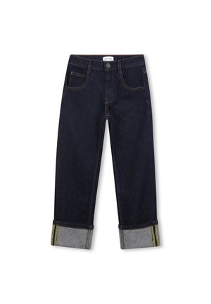 Jean en denim bleu foncé avec ourlets retroussés montrant un tissu intérieur gris et un détail de bande verte, avec poches avant et fermeture à bouton.