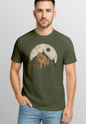 Olive green T-shirt featuring a circular mountain graphic with a sun and trees, printed in earthy tones. Short sleeves and crew neck design.