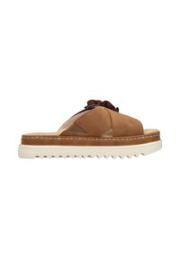 Brown leather slide sandal with textured upper, front ruffle detail, and a thick, textured white sole. Side view showcasing minimal design.