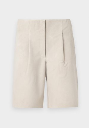 Beige suede shorts with a relaxed fit, featuring two front pleats and a clean waistband design. Smooth texture, mid-thigh length.