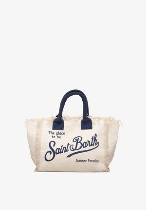 Beige canvas draagtas met donkerblauwe handvatten, franjes aan de rand en tekst "The place to be Saint Barth Summer Paradise" aan de voorkant.