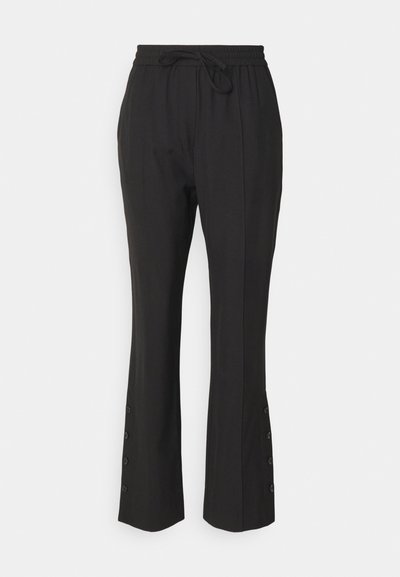 Black trousers with a drawstring waistband, tapered fit, and decorative button details at the hem. Smooth fabric with a slight sheen.