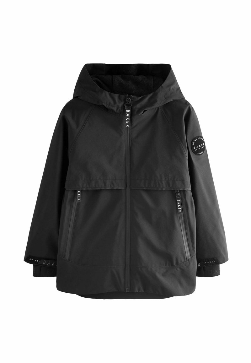 Veste noire à capuche avec fermeture éclair frontale, deux poches zippées et un patch rond sur la manche gauche, portant la marque "Baker".