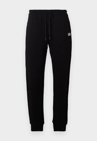 Melni kokvilnas sporta bikses ar elastīgu jostasvīru un regulējamu auklu. Neliels balts logs, kas izdrukāts priekšpusē. Ribu aproces potītēs.