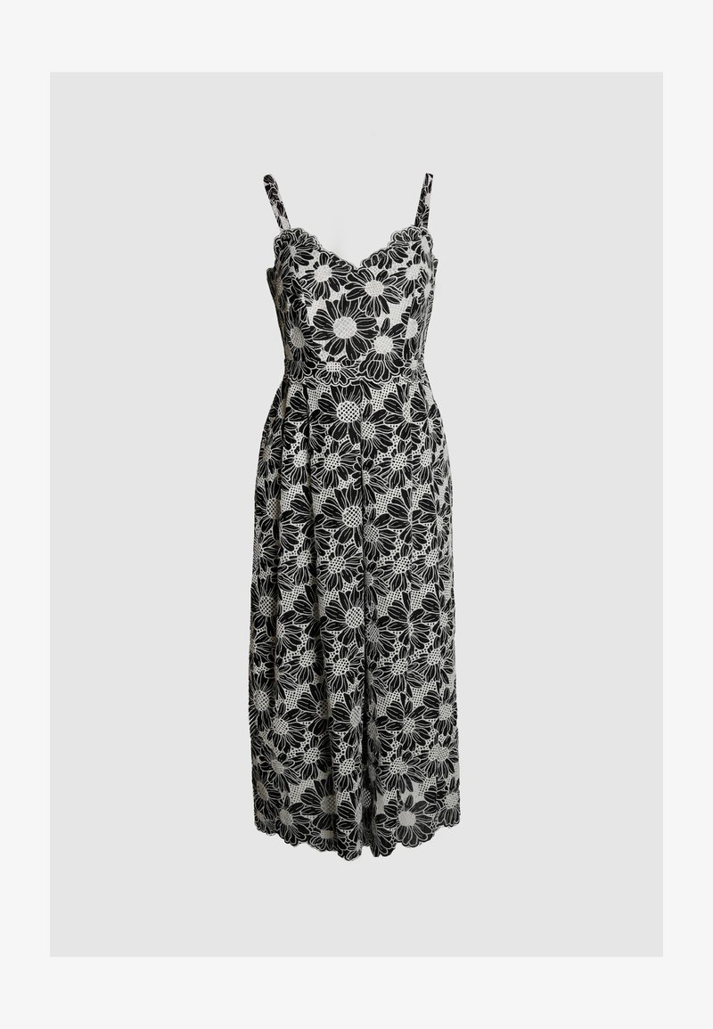 Black and white floral dress featuring a fitted bodice with scalloped neckline, thin straps, and a flowy midi-length skirt with lace details.