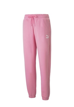 Lyserøde Puma joggingbukser med elastisk talje, snøring, sidelommer, elastiske manchetter og hvidt Puma-logo på venstre lår.