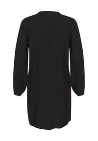 Vestido túnica negro con mangas largas, escote redondo y puños elásticos. Presenta un bordado detallado a lo largo de las costuras de las mangas. Textura de tela suave.