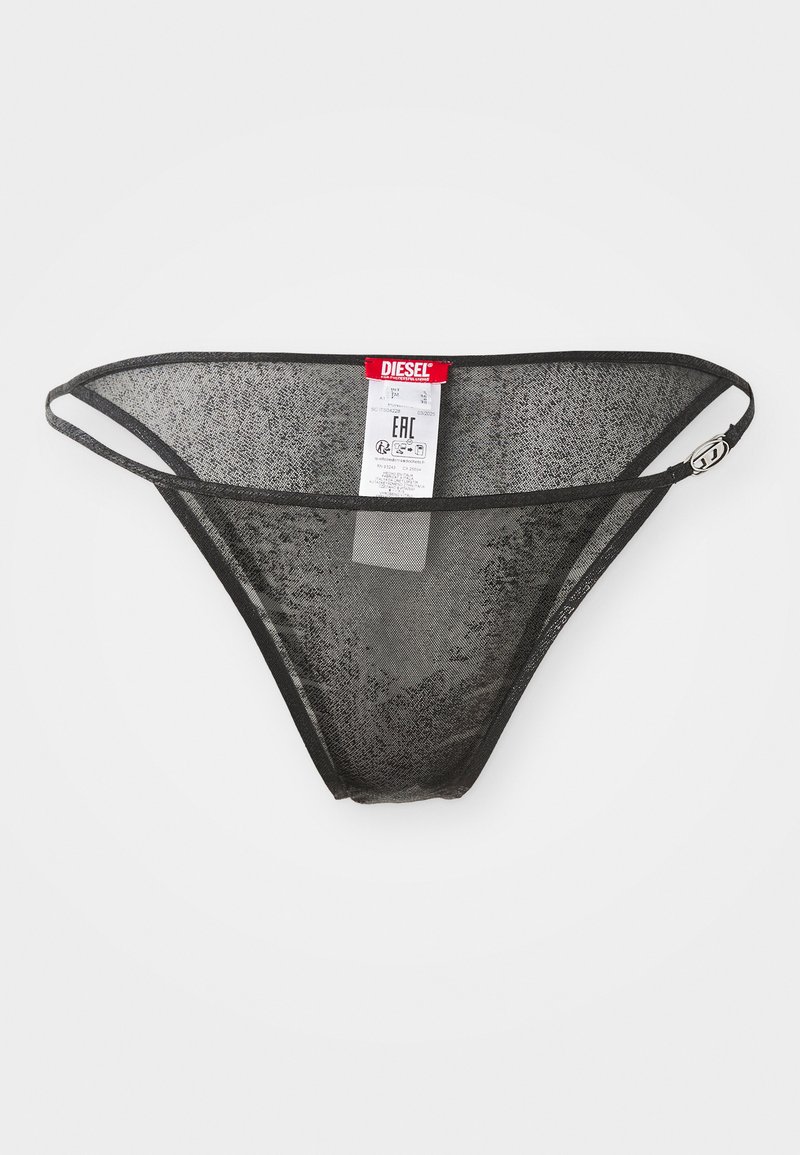 Zwarte gaasstring met dunne elastische banden, voorzien van een label met de merknaam 'Diesel.' Textuurstof en een ontwerp met minimale bedekking.