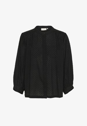 Svart blus i strukturerad tyg med små upphöjda prickar, långa puffärmar, en rund krage och knappstängning framtill.