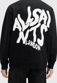 Black sweatshirt featuring large white “ALLSAINTS LONDON” logo on the back. Material appears soft; design includes a crew neck and ribbed cuffs.