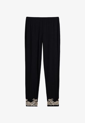 Pantalons noirs avec une taille élastique, dotés d'un ourlet étroit orné de dentelle florale beige au niveau des poignets. Texture de tissu douce.