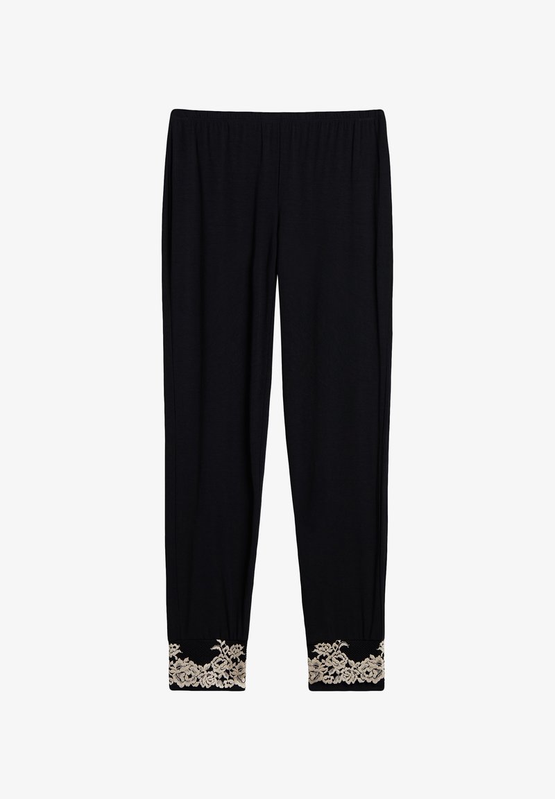 Pantalones negros con una waistband elástico, que cuentan con un dobladillo estrecho adornado con encaje floral beige en los puños. Textura de tejido suave.