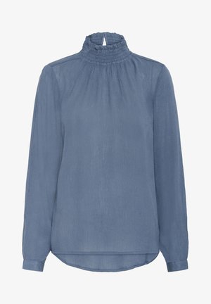 Mėlyna, ilgomis rankovėmis bluzonė su aukštu, susiraukšlėjusiu kaklu, raukšlėtu tekstūru ir šiek tiek lenktu apatine dalimi gale. Lengvas audinys.