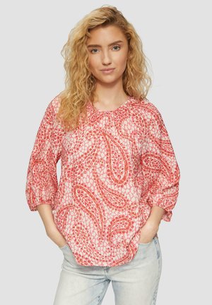 Pink paisley-patterned blouse with three-quarter sleeves, round neckline, and elastic cuffs, made from lightweight fabric.