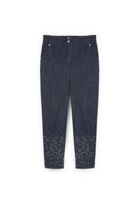Mörkblå jeans med en figurnära design, två fickor och dekorerade med silvernitar vid fållen, övergång från tät till gles.
