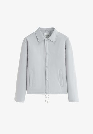Veste beige clair à boutons avec col plat, deux poches avant et cordon de serrage ajustable à l'ourlet. Fini lisse et mat.