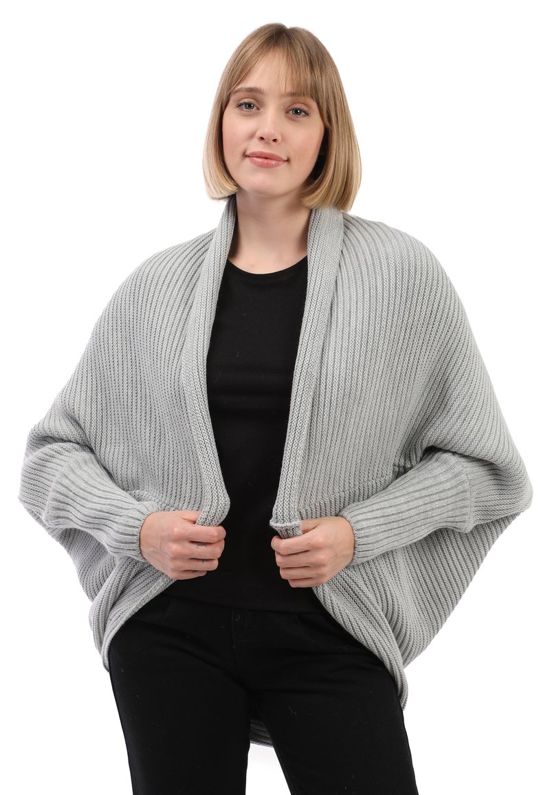 Lichtgrijze gebreide cardigan met ribbelstructuur, open voorkant en lange mouwen. Heeft een ontspannen pasvorm en een gedrapeerd ontwerp.