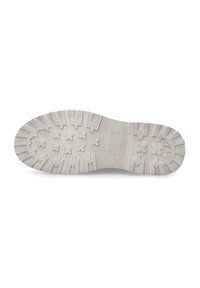 Weißer Gummisohlen mit tiefem Profil, das erhöhte geometrische Formen für besseren Halt und eine glatte, flache Oberfläche entlang der Kanten aufweist.