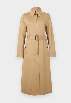 Beige long trench coat with collar, belted waist, buttoned flap pockets, and concealed front buttons, displayed on plain background.