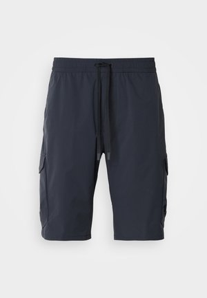 Calções de carga azuis marinho com um cós elástico, cordão à frente, bolsos laterais e textura suave. Tecido durável adequado para uso casual.