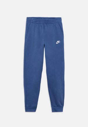 Kék Nike melegítőnadrág rugalmas derékpánttal és mandzsettákkal, oldalzsebekkel, valamint fehér Nike logóval a bal felső combon.