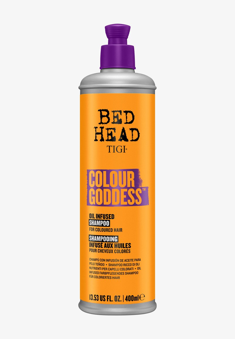 Shampoing Bed Head Colour Goddess infusé à l'huile pour cheveux colorés, bouteille orange de 400 ml avec bouchon et accents d'étiquette violets.