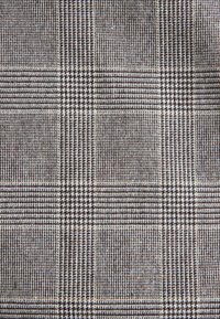 Brown and beige woven fabric with a check pattern, featuring alternating textured stripes and solid squares. Smooth, soft texture with structured design.