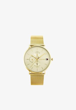 Zlaté hodinky s nerezovým pásikom, tromi subciferníkmi, minimalistickými hodinovými ukazovateľmi a logom Tommy Hilfiger na krémovom ciferníku.
