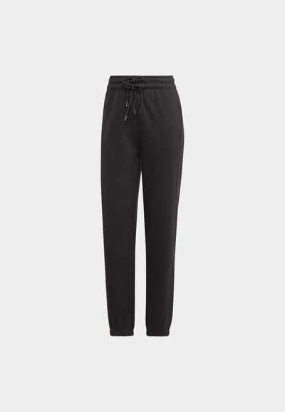 Schwarze Jogginghose aus weichem Stoff mit elastischem Bund, Kordelzugverschluss und schmal zulaufenden Beinen. Keine sichtbaren Muster oder Akzente.