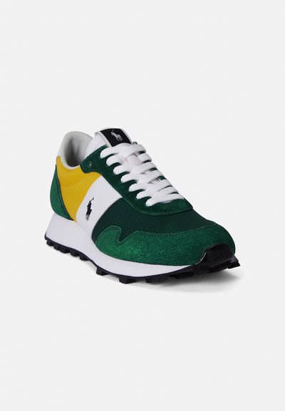 Πράσινα και λευκά αθλητικά παπούτσια με κίτρινες λεπτομέρειες. Υλικά από σουέτ και δίχτυ, με επενδυμένο πέλμα, λευκά κορδόνια και μαύρη ελαστική σόλα με υφή.