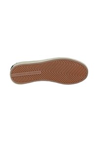 Suola in gomma di sneaker con un motivo a spina di pesce, caratterizzata da un colore beige e un accento rosa chiaro sul bordo, etichettata "CRIME LONDON."