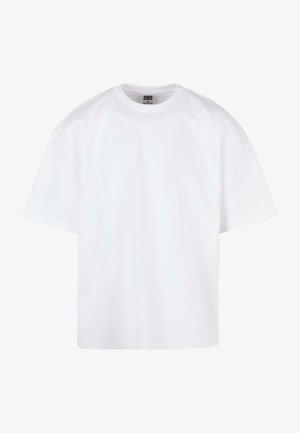 Valge puuvillane T-särk ümarate kaelustega, lühikeste varrukatega ja lõdva istuvusega. Omab lihtsat disaini ja sujuvat tekstuuri.