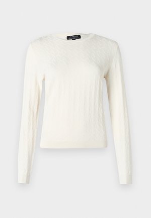 Maglione lavorato a maglia color crema con motivo a diamante, maniche lunghe e scollo rotondo. Texture morbida con polsini e orlo a coste.