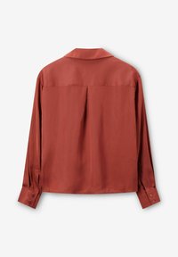 Rust-colored, long-sleeve shirt with a soft, smooth texture, featuring a classic collar, buttoned cuffs, and a back pleat detail.