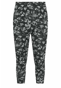 Zwarte legging met een abstract patroon van grijze cirkelvormige penseelstreken dat gelijkmatig over de stof is verspreid.