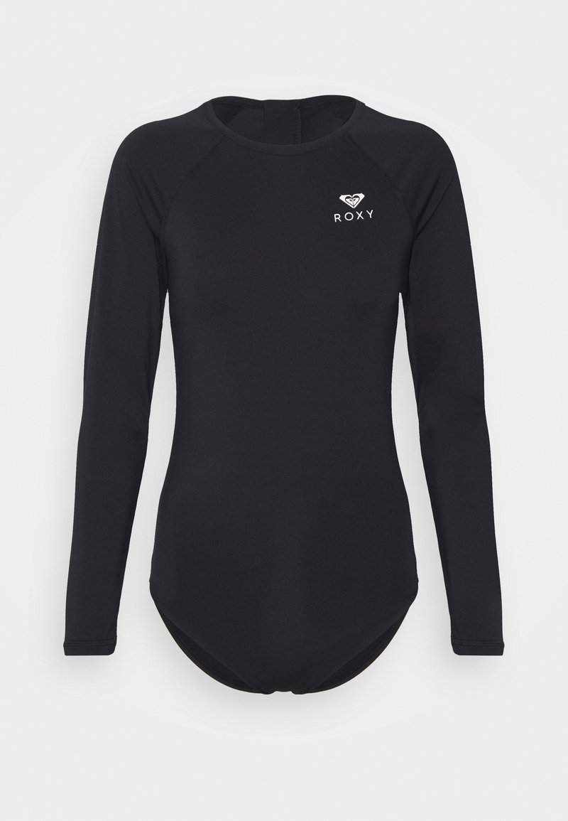 Rash guard negro de manga larga hecho de material elástico, con un cuello redondo y logo de Roxy en el lado izquierdo del pecho. Textura suave, forma ajustada.