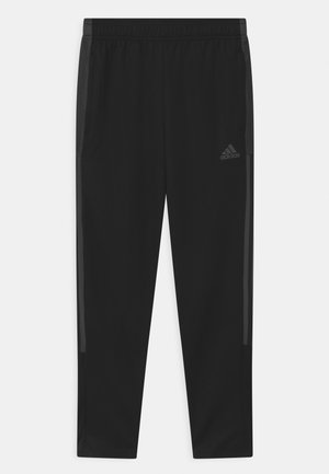 TIRO UNISEX - Tracksuit bottoms - black