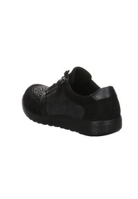 Black athletic shoe featuring a combination of suede and synthetic leather. Detailed with zippers, textured accents, and a patterned upper.