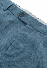 Light blue textured trousers featuring a button closure, flat front, and side pockets, with a subtle woven pattern for added detail.