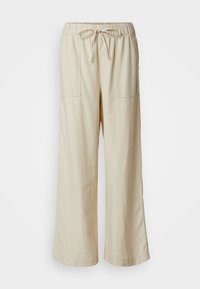 Pantaloni larghi in lino beige con vita elastica e coulisse, dotati di due tasche frontali e una finitura morbida e testurizzata.