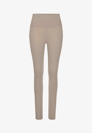 Beige Leggings aus dehnbarem Material, mit hohem Bund, glatter Textur und nahtlosem Design für Komfort und Flexibilität.