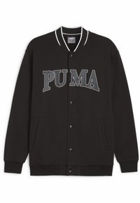 Veste noire à fermeture éclair en tissu doux avec une bordure blanche, un grand logo "PUMA" gris, des boutons-pression et des poches latérales.