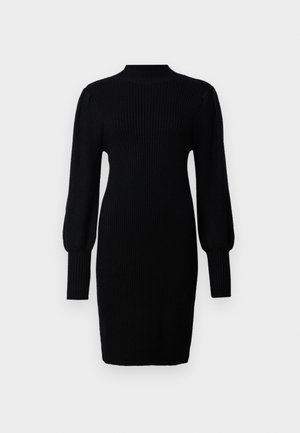 Črna pletena obleka z visokim ovratnikom, rebrasto teksturo, dolgimi balonskimi rokavi in prilegajočo silhueto, ki sega do sredine stegna.