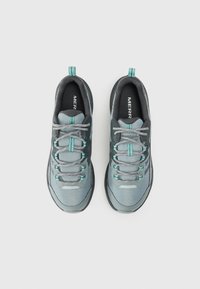Grey athletic shoes with mesh upper, teal accents, and reflective detailing. Rounded toe, padded collar, and laces in matching grey tone.