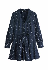 Marineblaues Kleid mit weißen Punkten, langen Ärmeln, V-Ausschnitt, Taillenschleife und plissiertem Rock. Aus strukturiertem Stoff gefertigt.